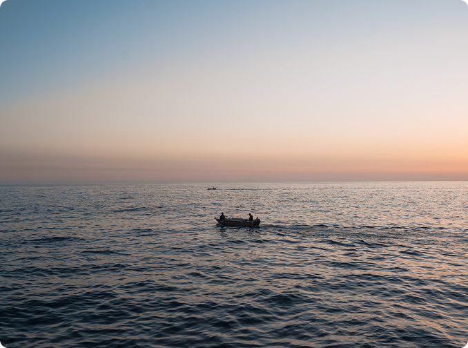Vessel on the sea at sunset